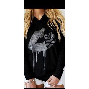 Skull lightweight sweatshirt with kissy lips, perfect for spring or fall weather